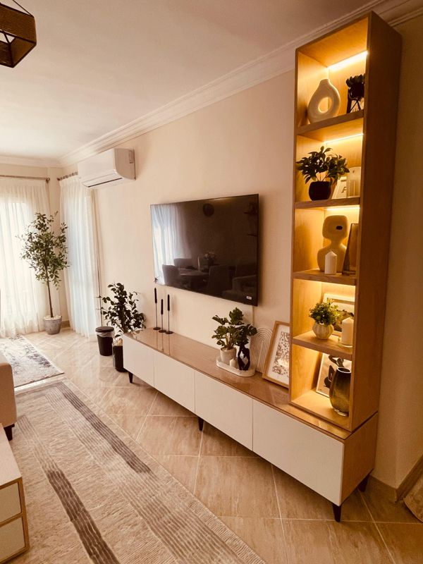 TV wall with lit shelving